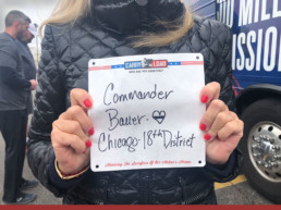 image of person holding a paper sign